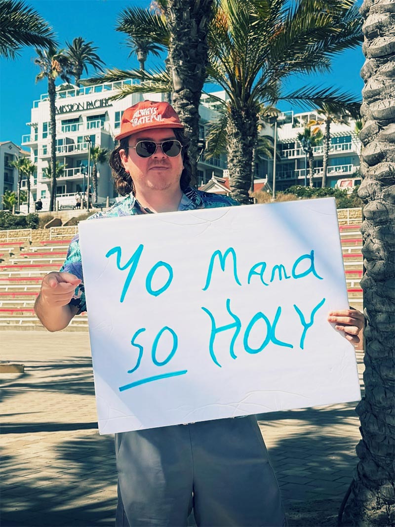 Matt holding up a sign